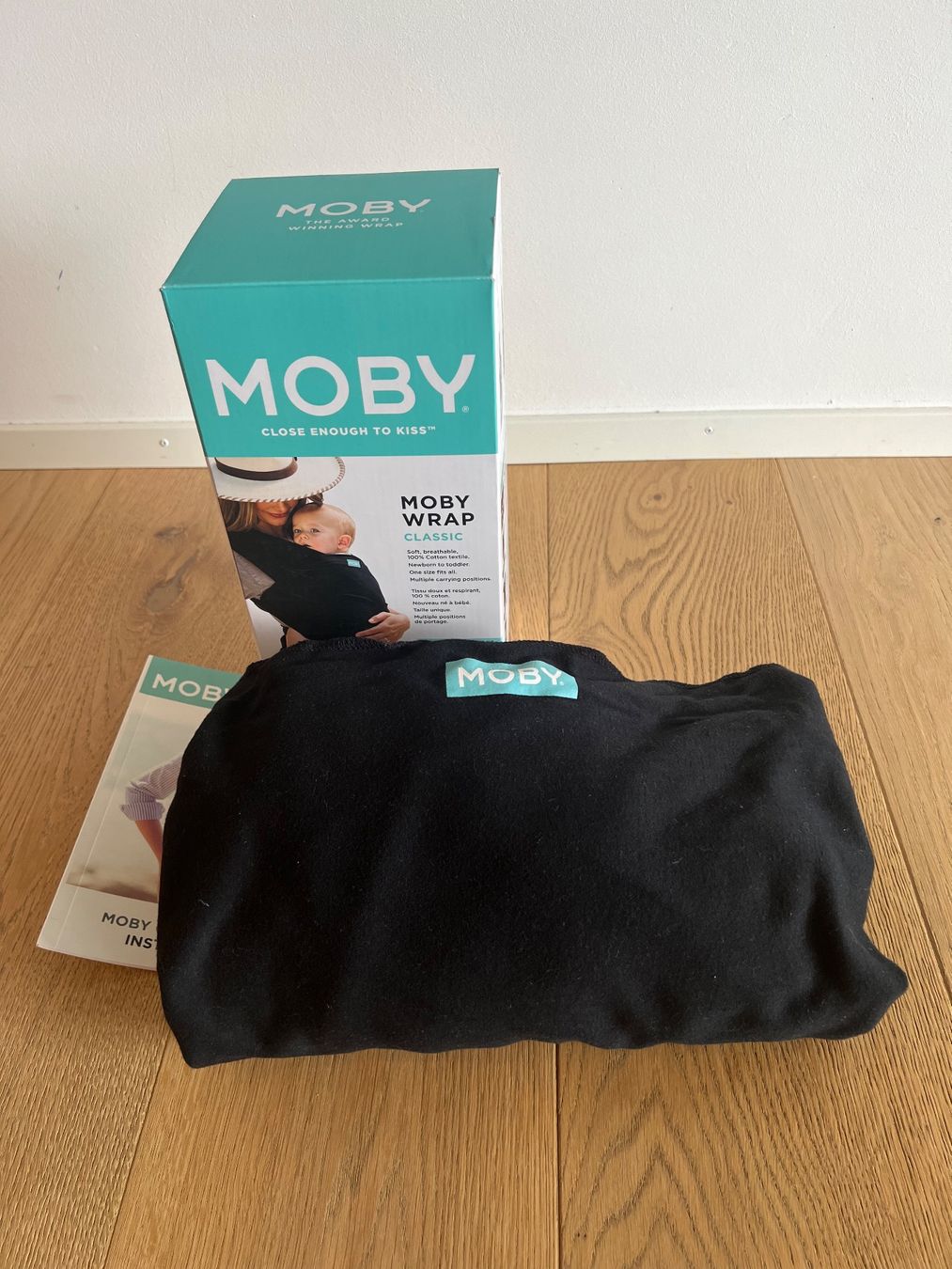 Moby Wrap Porte-bébés ventraux & dorsaux: Moby Wrap Classic Tragetuch, schwarz, neuwertiger Zustand – D'occasion à Horgen par jes_tx9v 1
