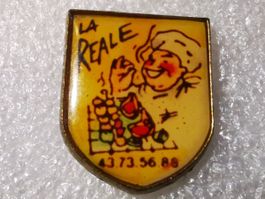 Ansteckpin 14: la reale