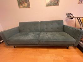 Grünes Klappsofa
