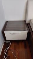 Bedside table with dark wood and white drawer