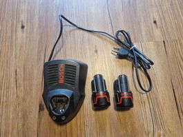 Bosch Akku Schnell-Ladegerät + 2x Akkus 10.8V 1Ah 10.8Wh