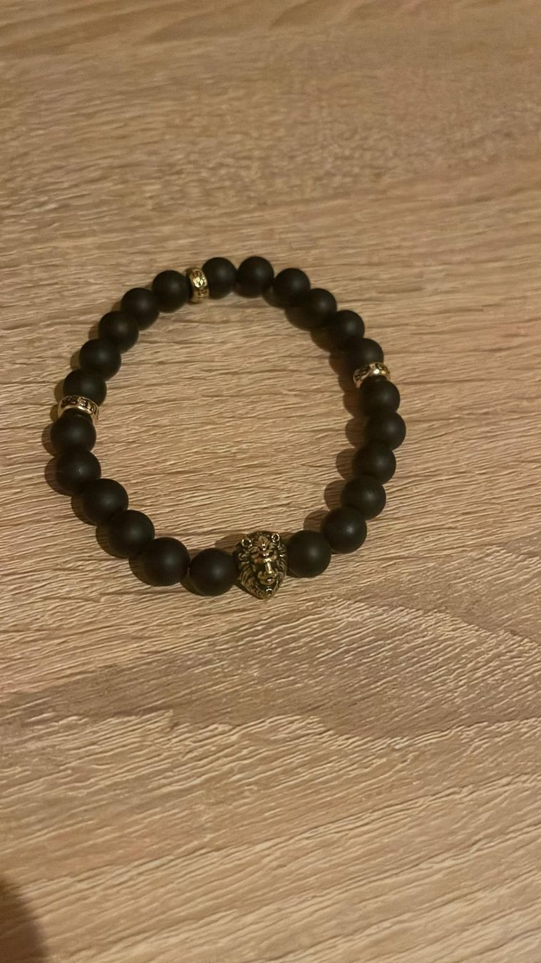Guess Armbänder & -reifen: Guess Armband, schwarz-gold – Gebraucht aus Birsfelden von twoheadeagleks