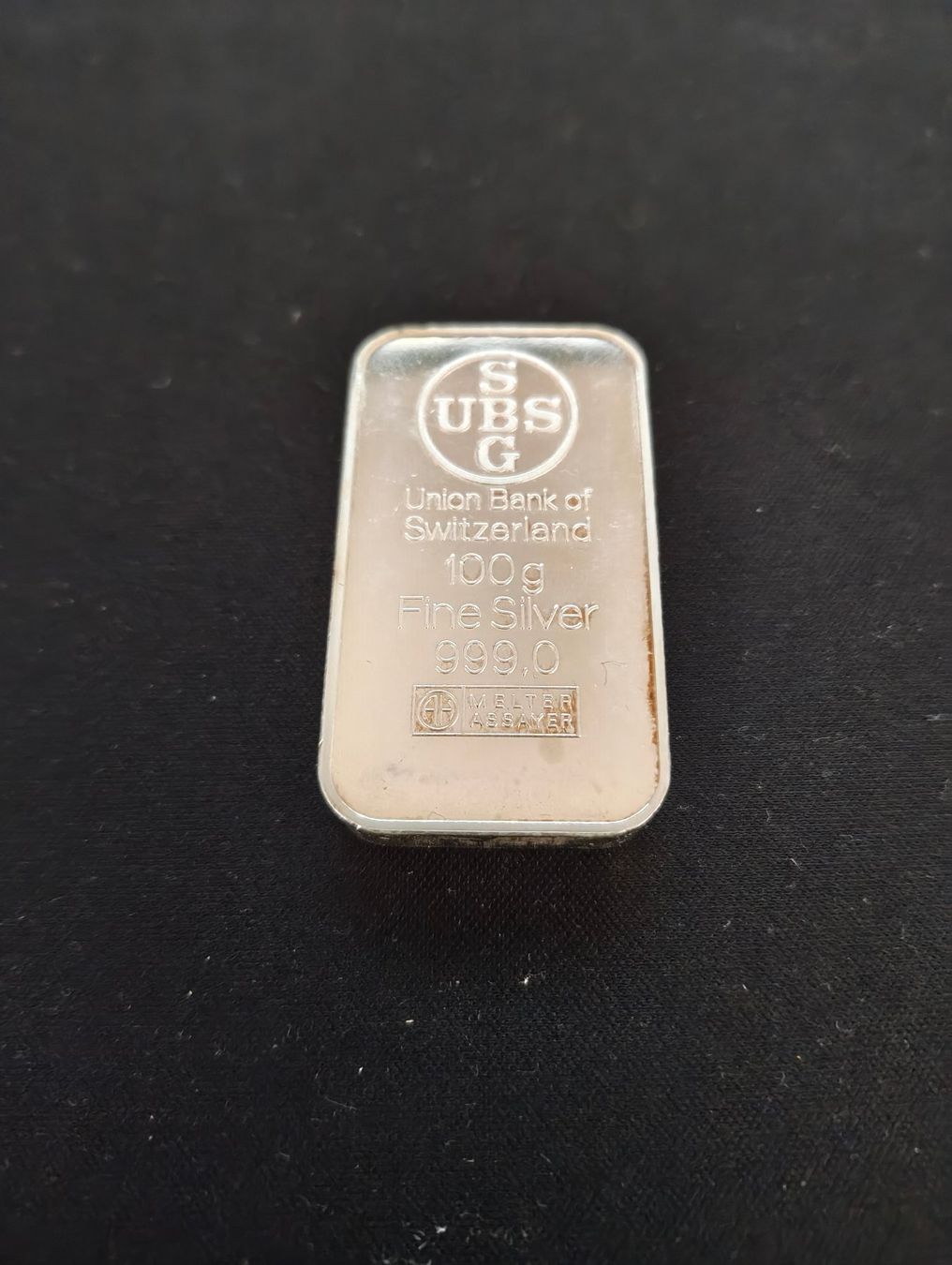 Metalli preziosi: Feinsilberbarren UBS 100g 999.0 – Usato da Aarau venduto da Revenant8