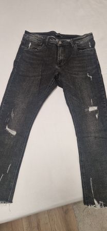 Jean noir délavé troué, taille 36 homme