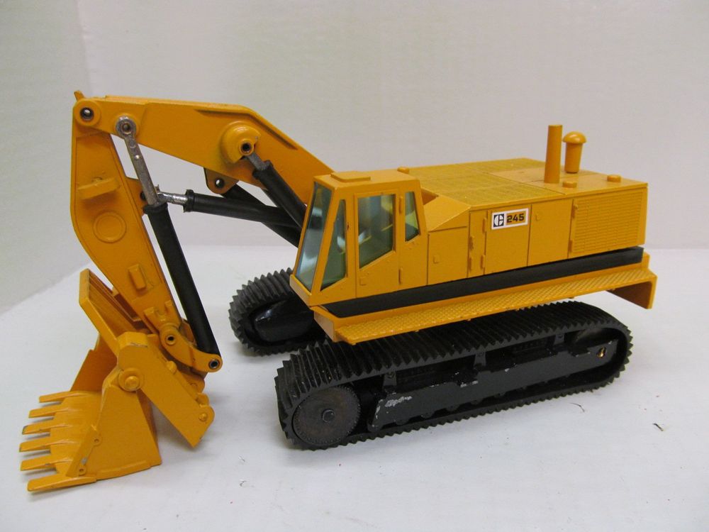 Caterpillar 245 pelle rétro sur chenilles - NZG