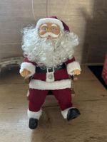 Vintage Nostalgie Weihnachtsmann im Schaukelstuhl