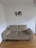 Canapé cuir beige 2 places en bon état