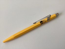 Carand'Ache 849 Kugelschreiber gelb, mit Werbeaufdruck