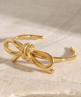 Goldfarbener Armreif mit Schleife - Edler Hingucker!
