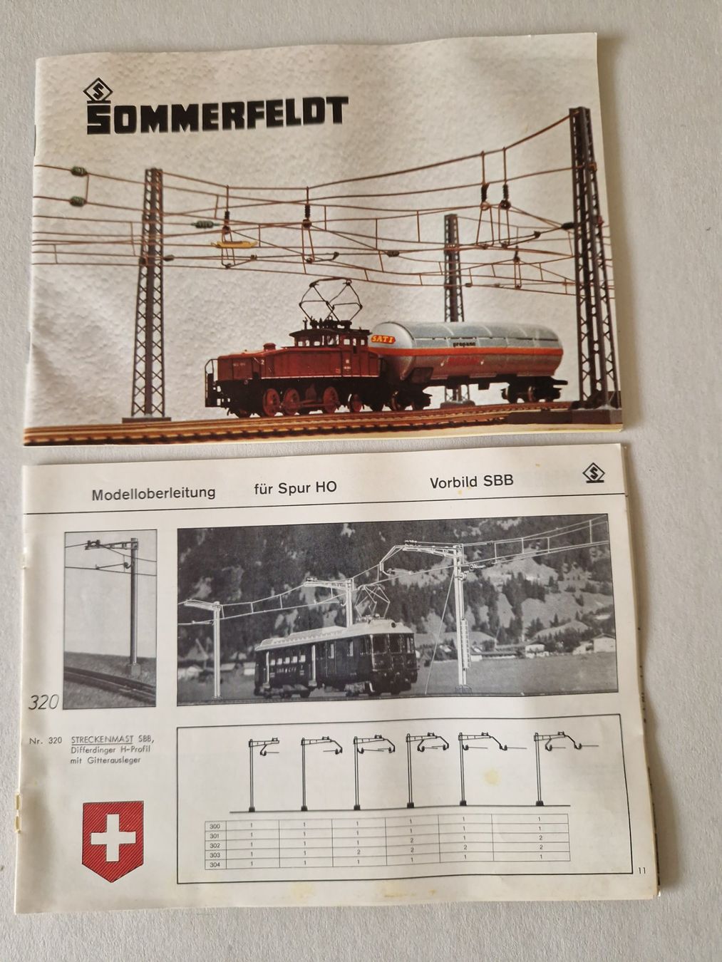 Sommerfeldt Modellini di ferrovie: Sommerfeldt Modellbahn Oberleitung H0 – Nuovo (secondo la descrizione) da Goldau venduto da Helipilot