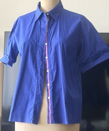 Blue short-sleeve shirt with red stripe detail