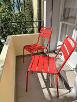 Pair of red Vermobil metal chairs