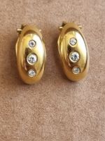 Goldene Ohrclips mit Zirkonia - Zeitloser Schmuck 