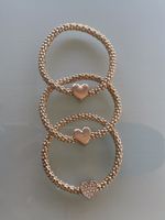 Set de 3 bracelets Guess dorés cœurs - neufs
