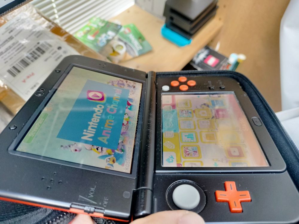 New Nintendo 3DS XL orange *RAR* + Spiele (Gebraucht) in Wil SG für CHF ...