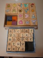 Stempelset Holz mit Buchstaben und Motiven gebraucht