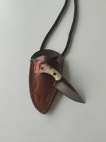 Handgefertigtes Kettenmesser mit Scheide.