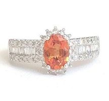 Juwelenring: 1 oranger Saphir 0.95 ct., 66 Diamanten, 1980.-