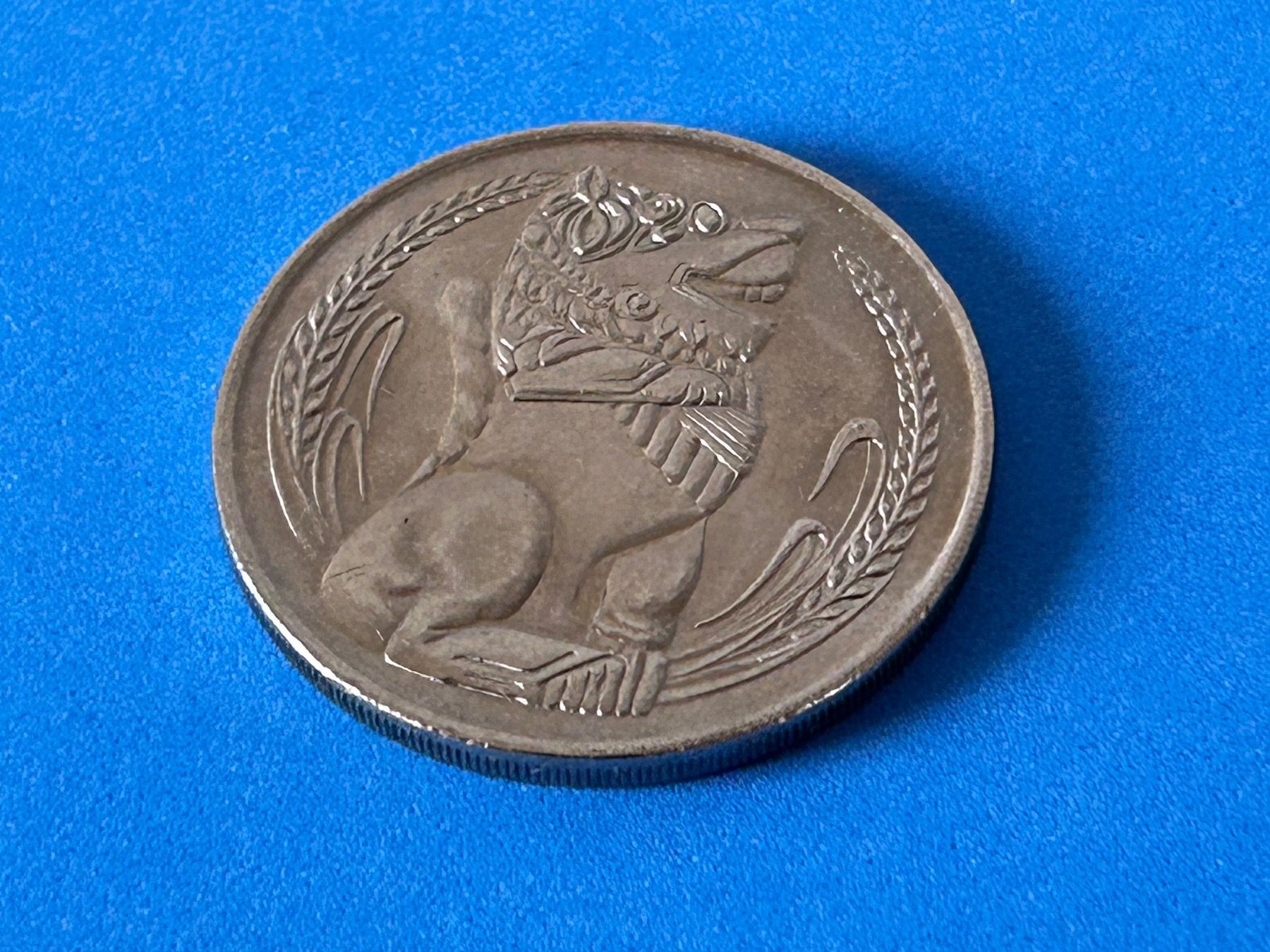 Tutti le monete: Singapore - 1 Dollar 1982 – Usato da Corcelles NE venduto da AJKader 3