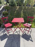 Tisch und 2 Stühle rot klappbar gebrauchter Zustand