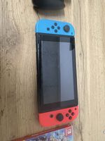 Nintendo Switch mit Mario Kart und Super Smash Bros