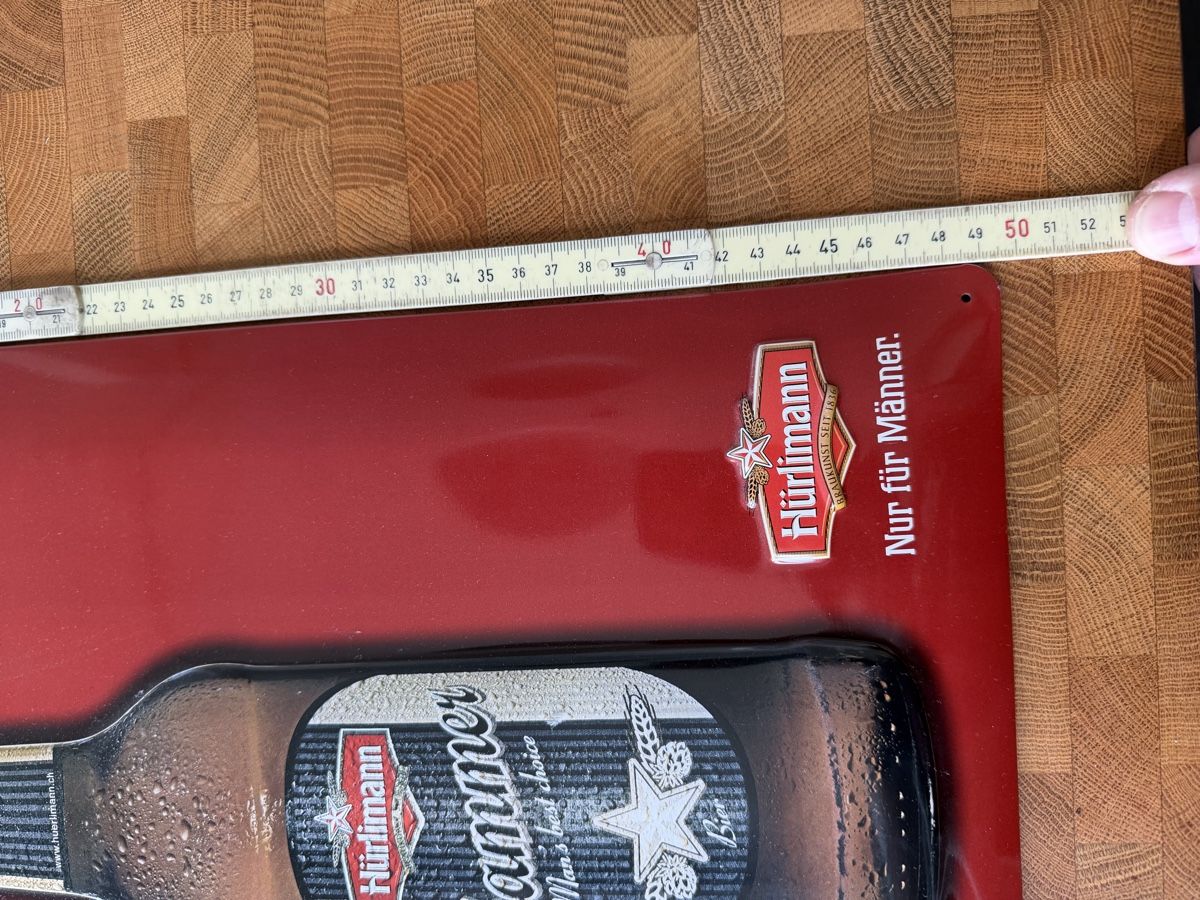 Hürlimann Insegne: Hürlimann Hammer - Blechschild - Echte Männer brauchen... – Usato da Bremgarten AG venduto da moreman 2