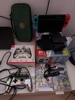 Nintendo Switch mit Zubehör und 2 Spielen