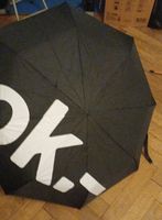 Schirm schwarz mit Aufdruck OK gebrauchter Zustand