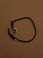Bucherer Au750 gold, Black Cord Bracelet.
