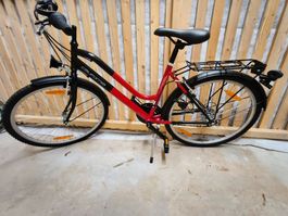 Sturdy Red City Bike, Perfect for Spring Commutes!