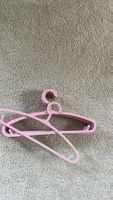 Set of 10 pink plastic hangers for children