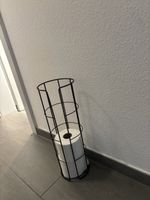 Schwarzer Toilettenpapierhalter aus Metall