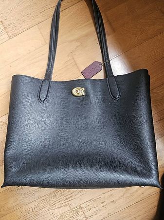 Schwarze Coach Handtasche - Perfekt für den Sommer!