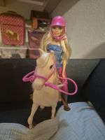 Barbie doll with horse and riding accessories set