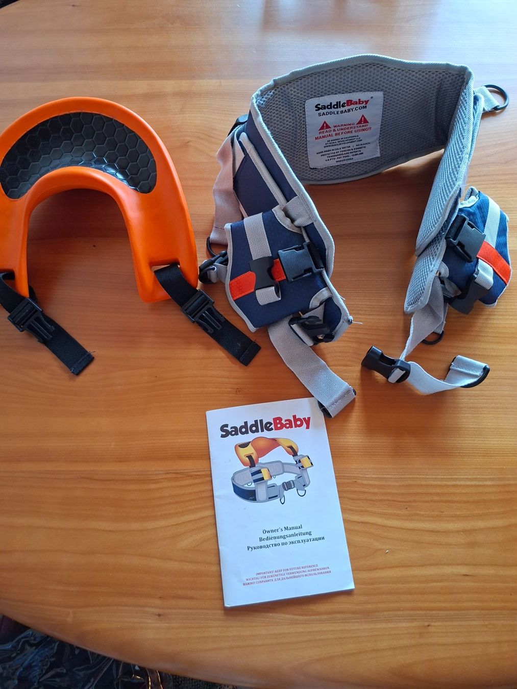 Marsupi portabebè: SaddleBaby Kindertrage mit Anleitung gebraucht – Usato da Neftenbach venduto da schiahoi