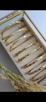 Bracelet doré parfait pour l' été. Élégant et luxueux