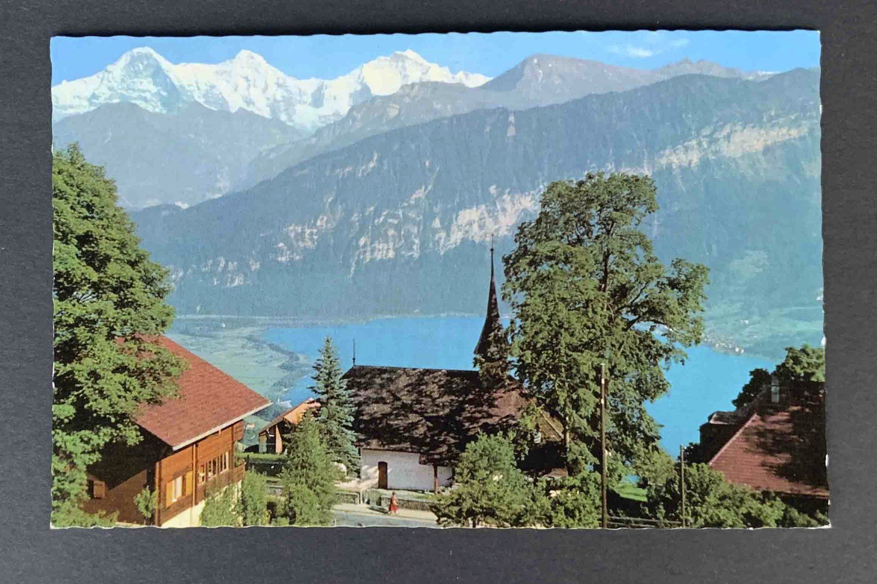 Cartoline postali: AK Beatenberg Kirche mit Eiger Mönch Jungfrau und Thunersee – Usato da Goldau venduto da artelier1