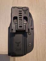 Verschiedene Pistolenholster für eine SIG Sauer P320