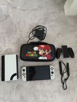 Nintendo Switch OLED Modell weiss mit Mario Tasche Zubehoer