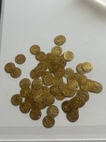 Goldfarbene Muenzen im Tütchen (S40)