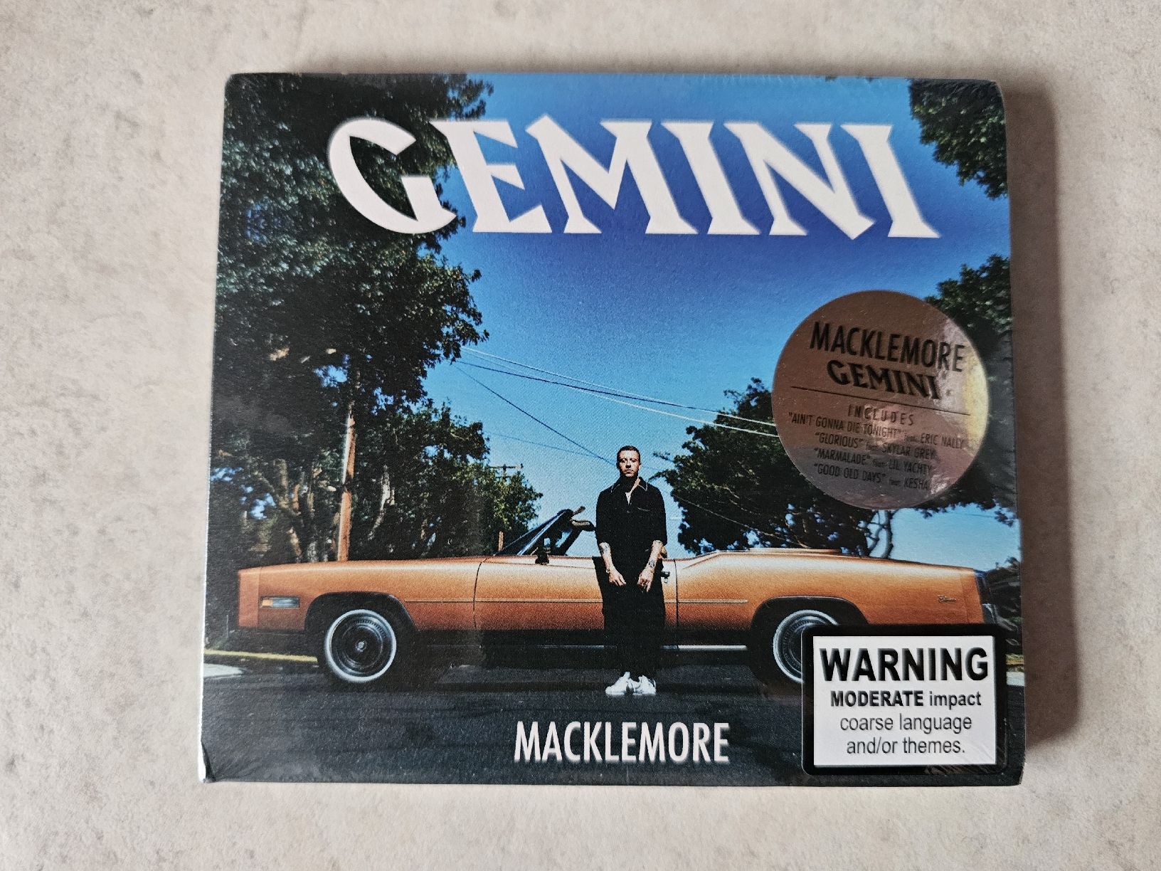 CD: Macklemore  -  Gemini  /  Fabrikneu – Nuovo e nell'imballaggio originale da Schneisingen venduto da backstore24