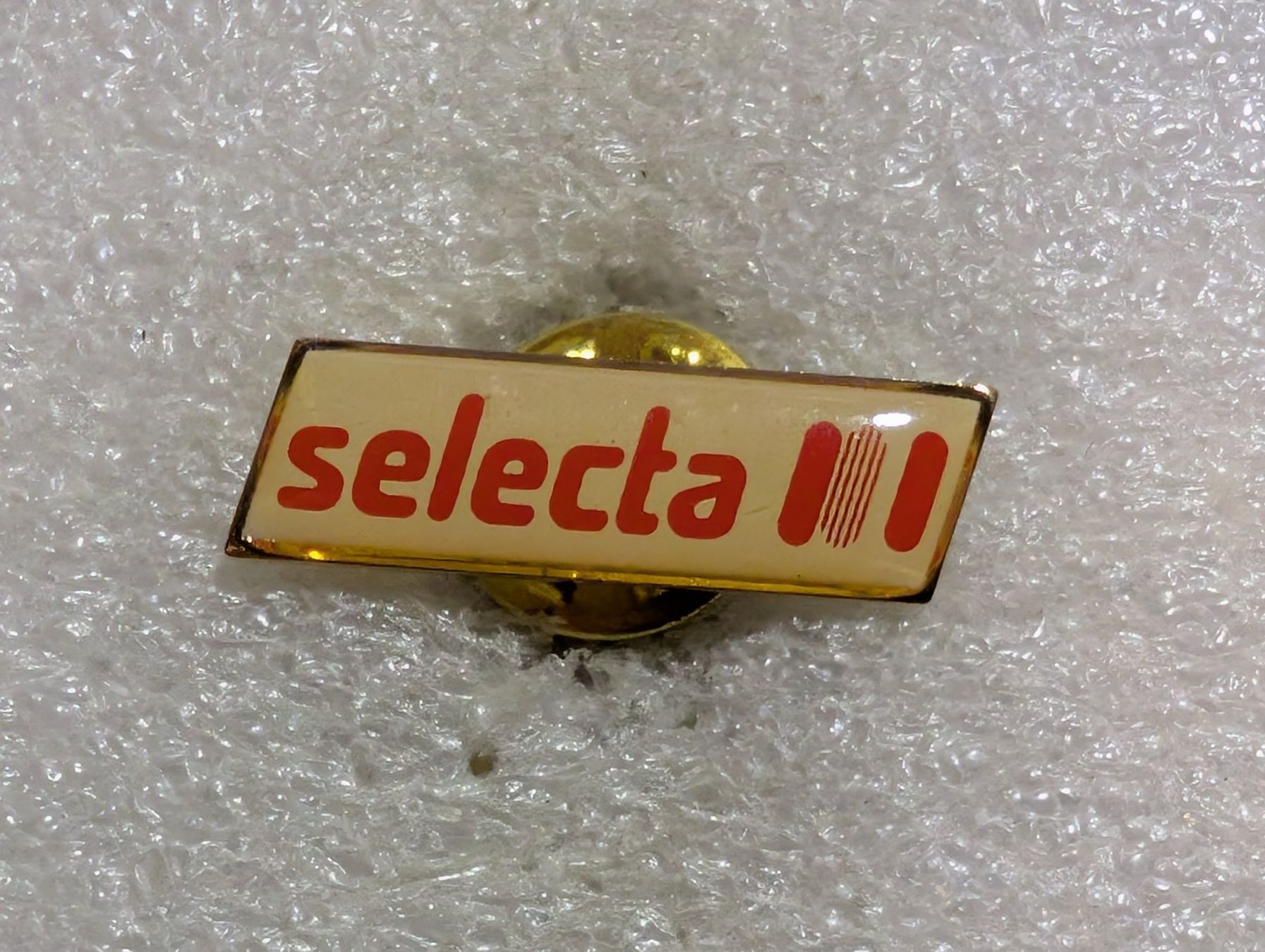 Placchette & Badge: Ansteckpin 91: Selecta – Usato da Oppligen venduto da Pin-Fall-Shop