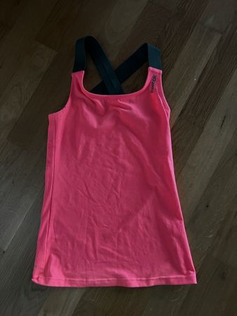 Débardeur Reebok rose fluo, taille XS, parfait pour l'été!