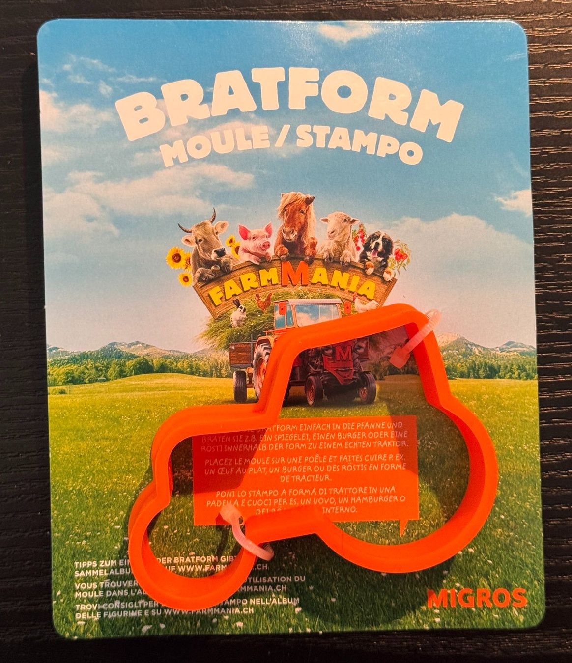 Migros Giocattoli: 1 Migros Farmmania 2016 - Bratform – Nuovo e nell'imballaggio originale da Zürich venduto da Policepatch