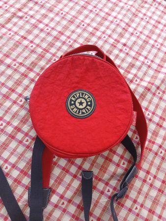 Sac à dos rond rouge Kipling