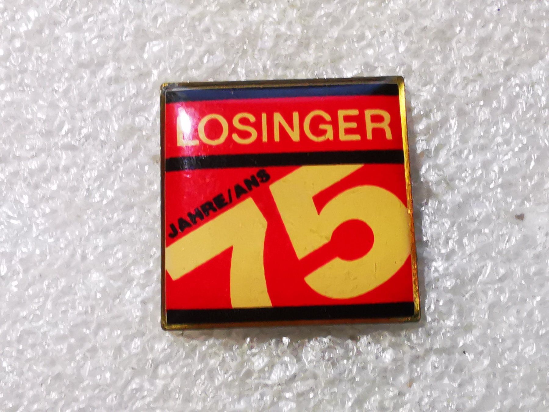 Placchette & Badge: Ansteckpin 54: 75 Jahre Losinger – Usato da Oppligen venduto da Pin-Fall-Shop