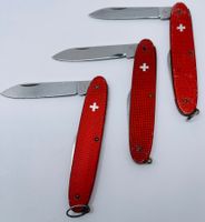 2x Elinox- 1x Victorinox Taschenmesser, Alox rot m. CH-Kreuz