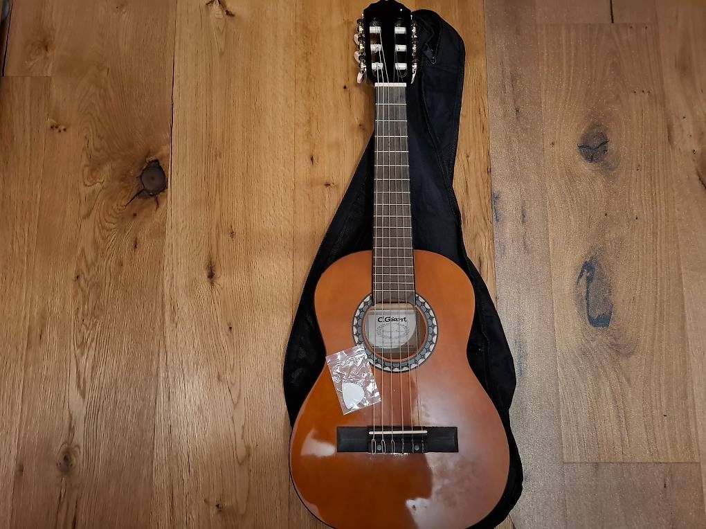 Musikinstrumente: Gitarre 1/4 – Gebraucht aus Halten von Mutzji 2