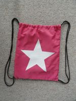 Turnbeutel pink mit weissem Stern und seitlicher Tasche