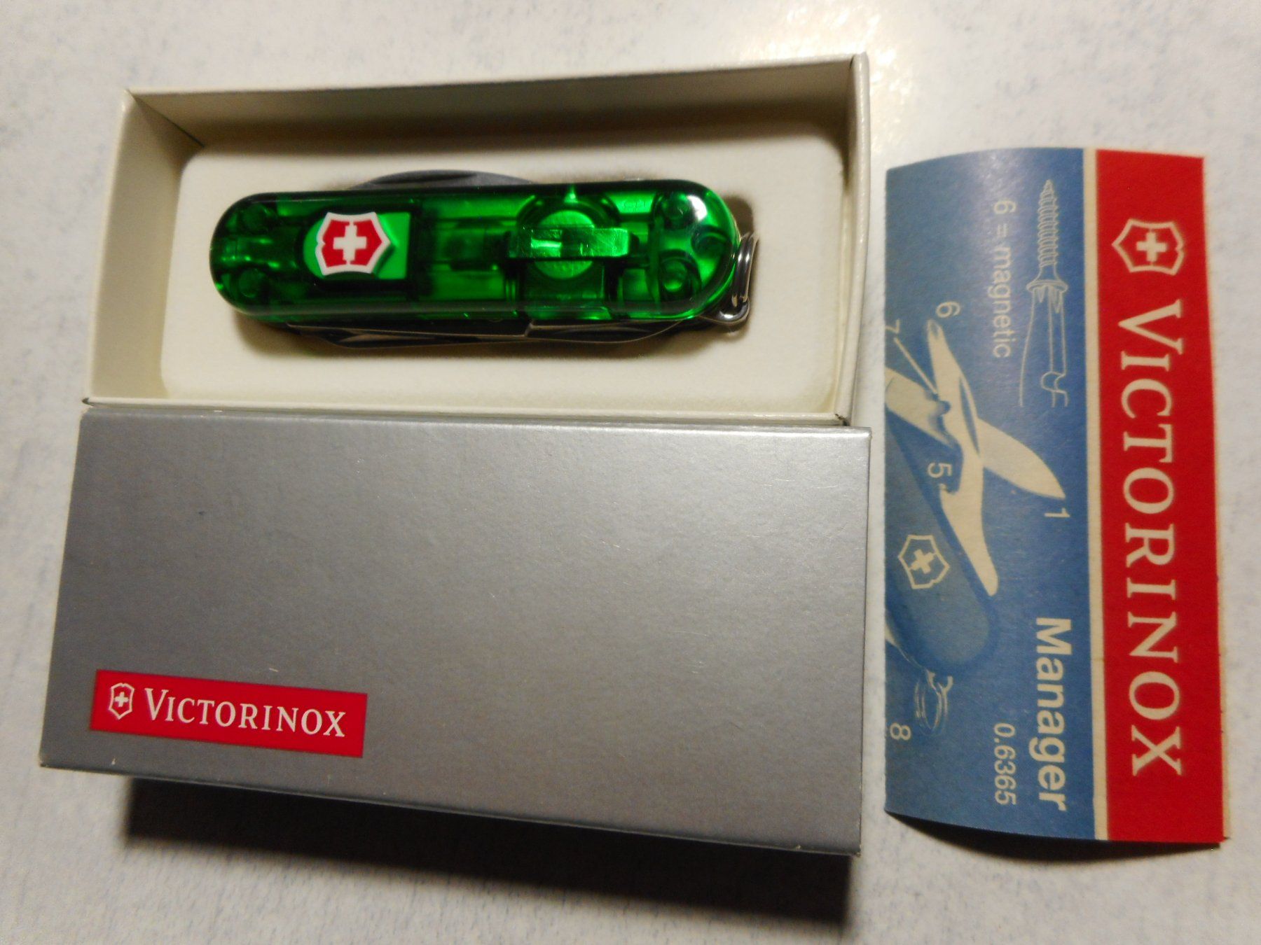 Victorinox Coltelli tascabile: Victorinox  Midnite/Manager 0.6366.T4 - Smaragd – Nuovo e nell'imballaggio originale da Rotkreuz venduto da Hubbil